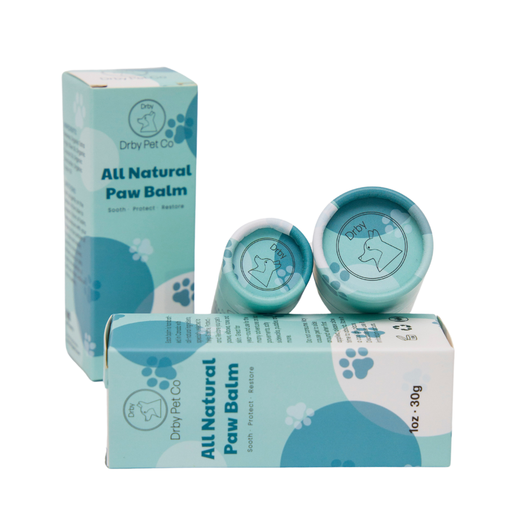 All natural paw balm packaging with two jars and a box on a white background