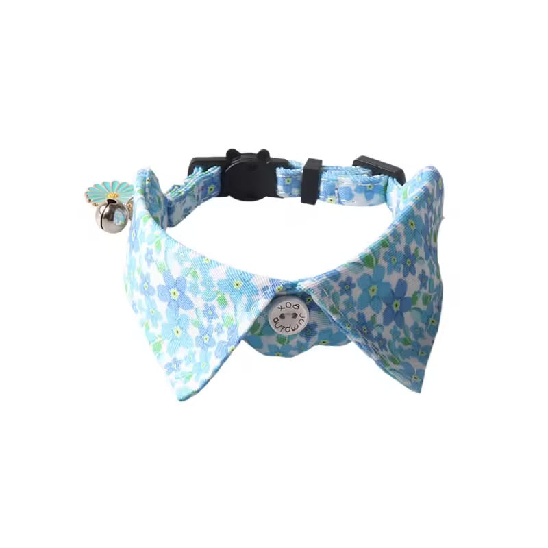 a blue floral print bow tie cat collar on a white background.