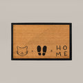Doormat with a cat face, footprints, and 'HOME' text on a beige background