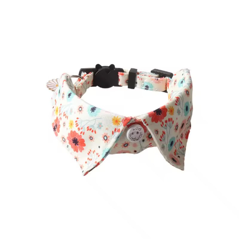 A white floral print bow tie collar on a white background.
