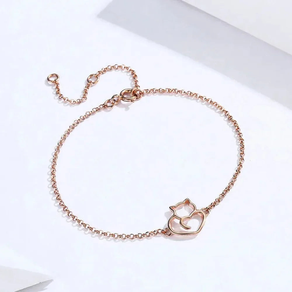 Rose gold cat bracelet flat lay jewelry photo