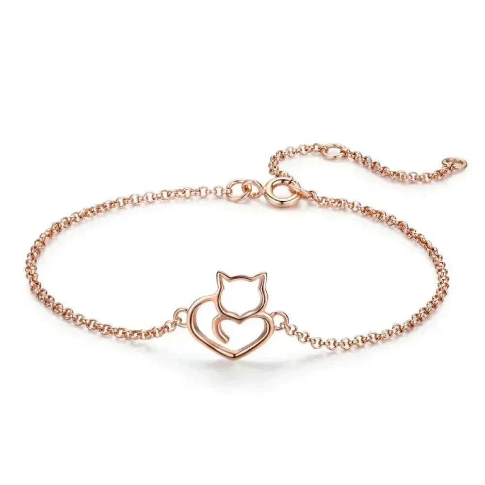 Rose gold sterling silver cat heart bracelet on white background