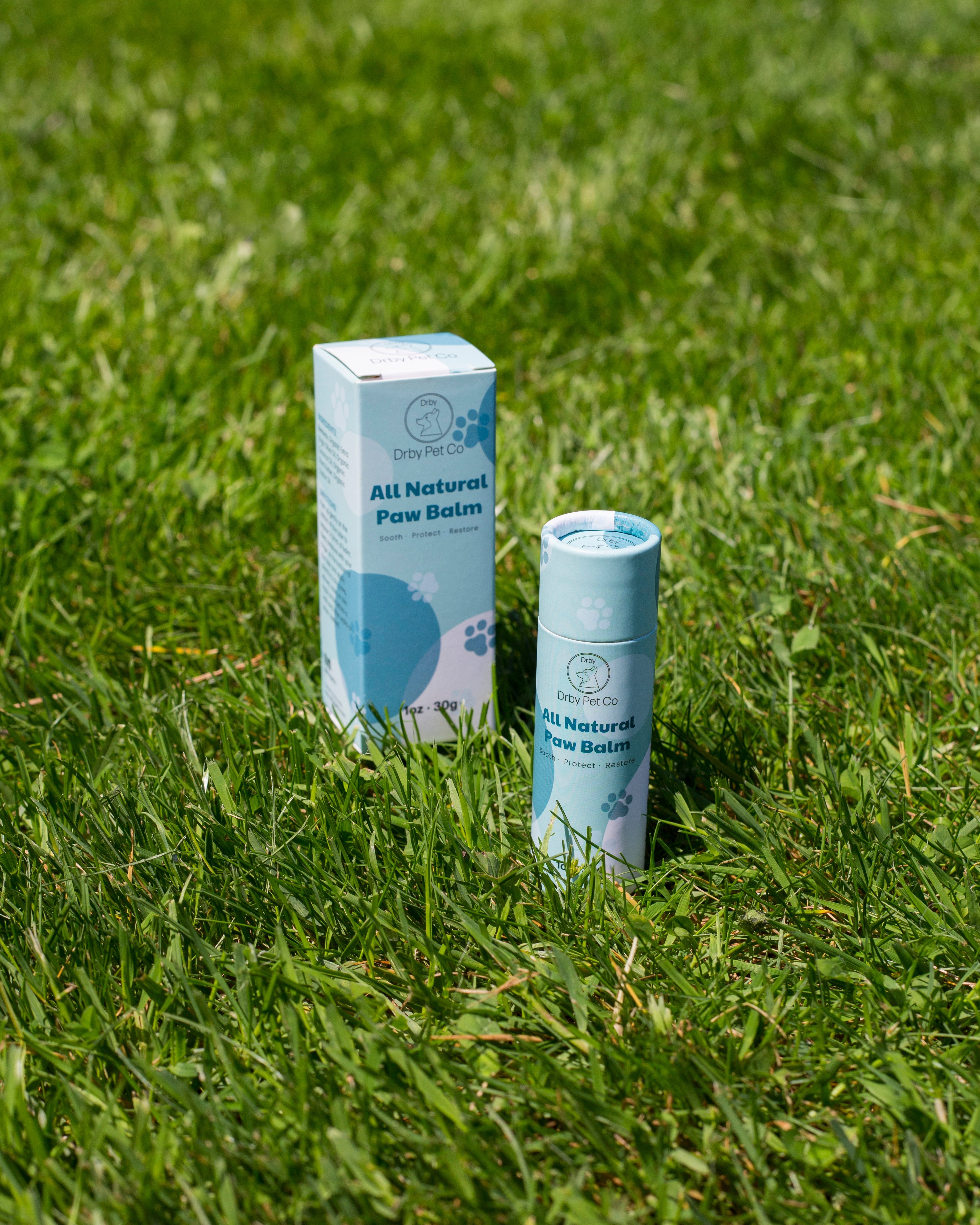 All Natural Paw Balm packaging on grass