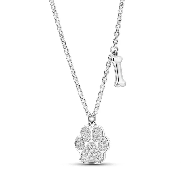 Silver necklace with a paw print pendant on a white background