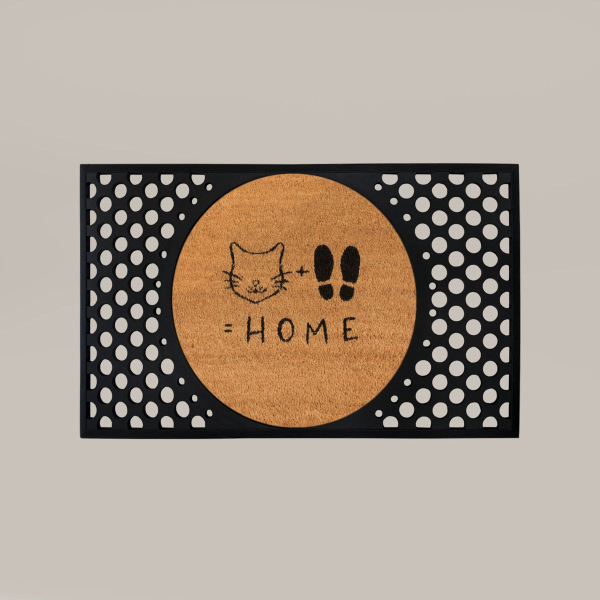 Cat + Feet = Home doormat featuring a round natural coir insert with cat face and footprints design, surrounded by a black rectangular rubber frame with circular cutouts.
