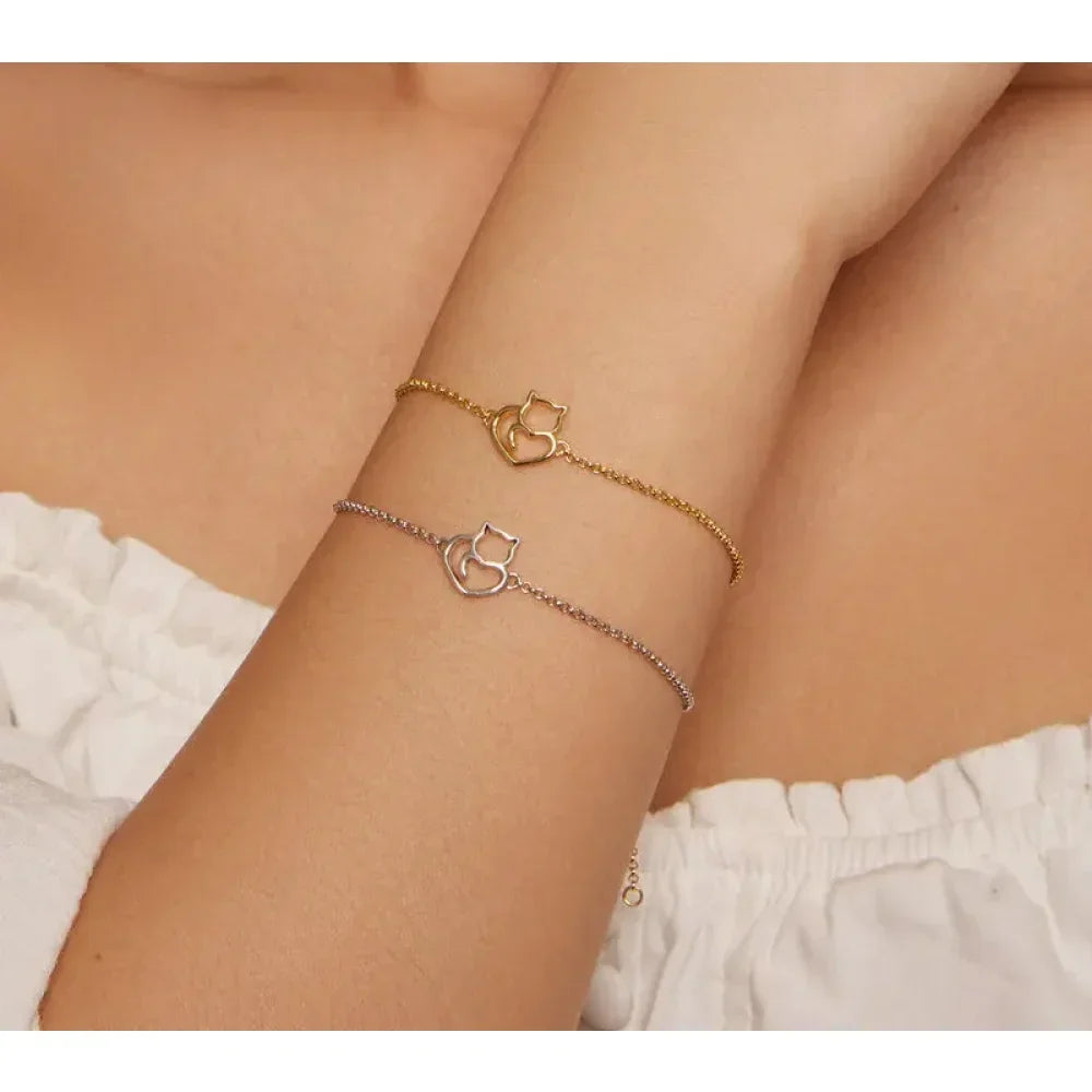 Minimal cat heart bracelet worn on wrist