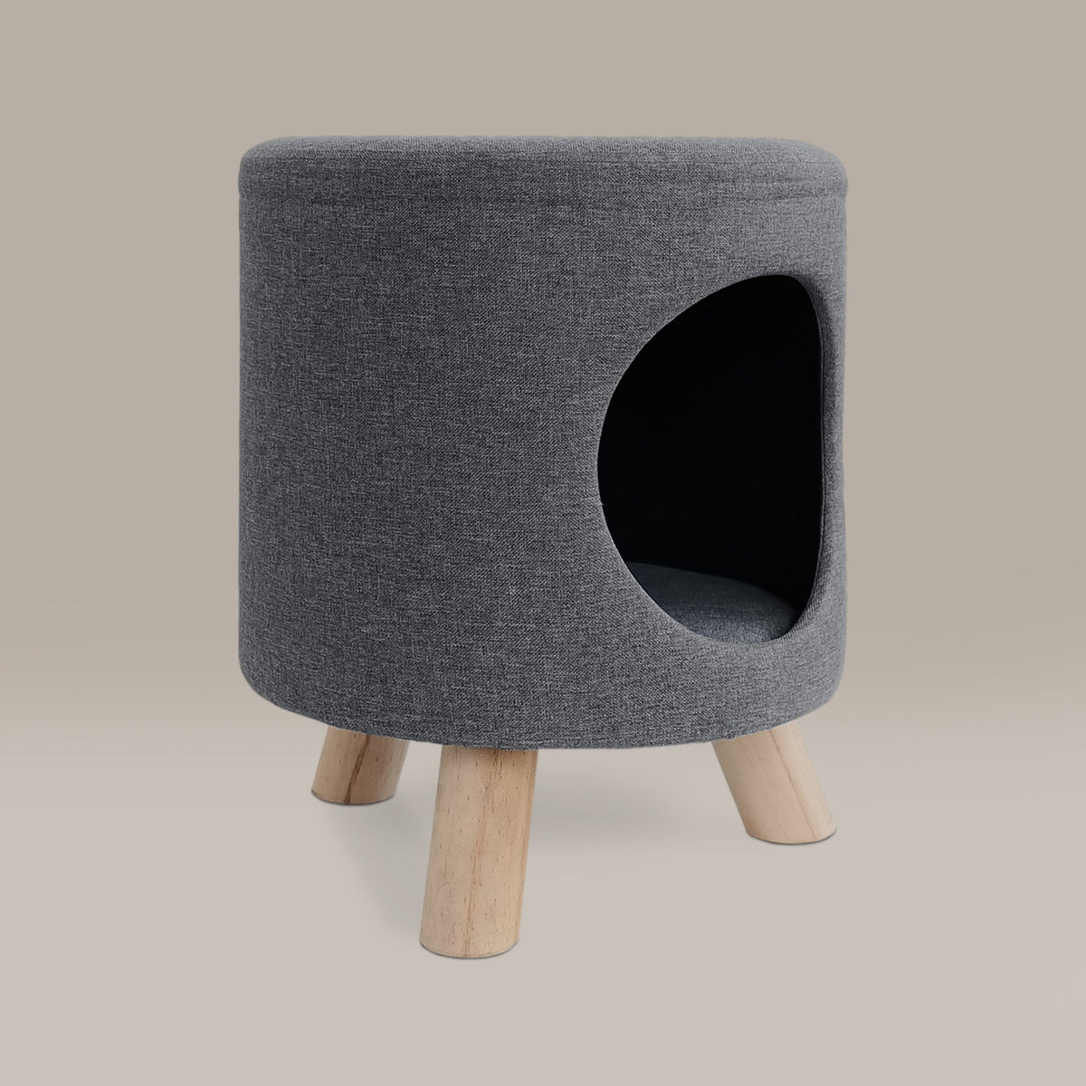 Gray upholstered stool with wooden legs on a beige background